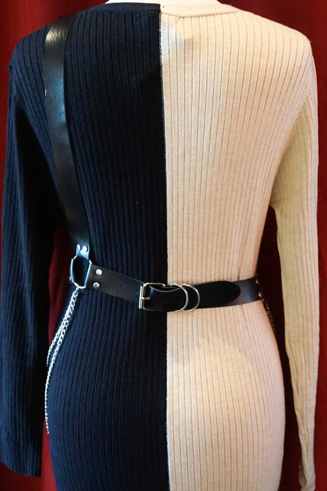 faux leather harness, silver chains, adjustable waist, punk vibe, rock and roll