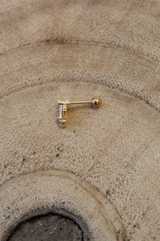 Golden earring tragus piering